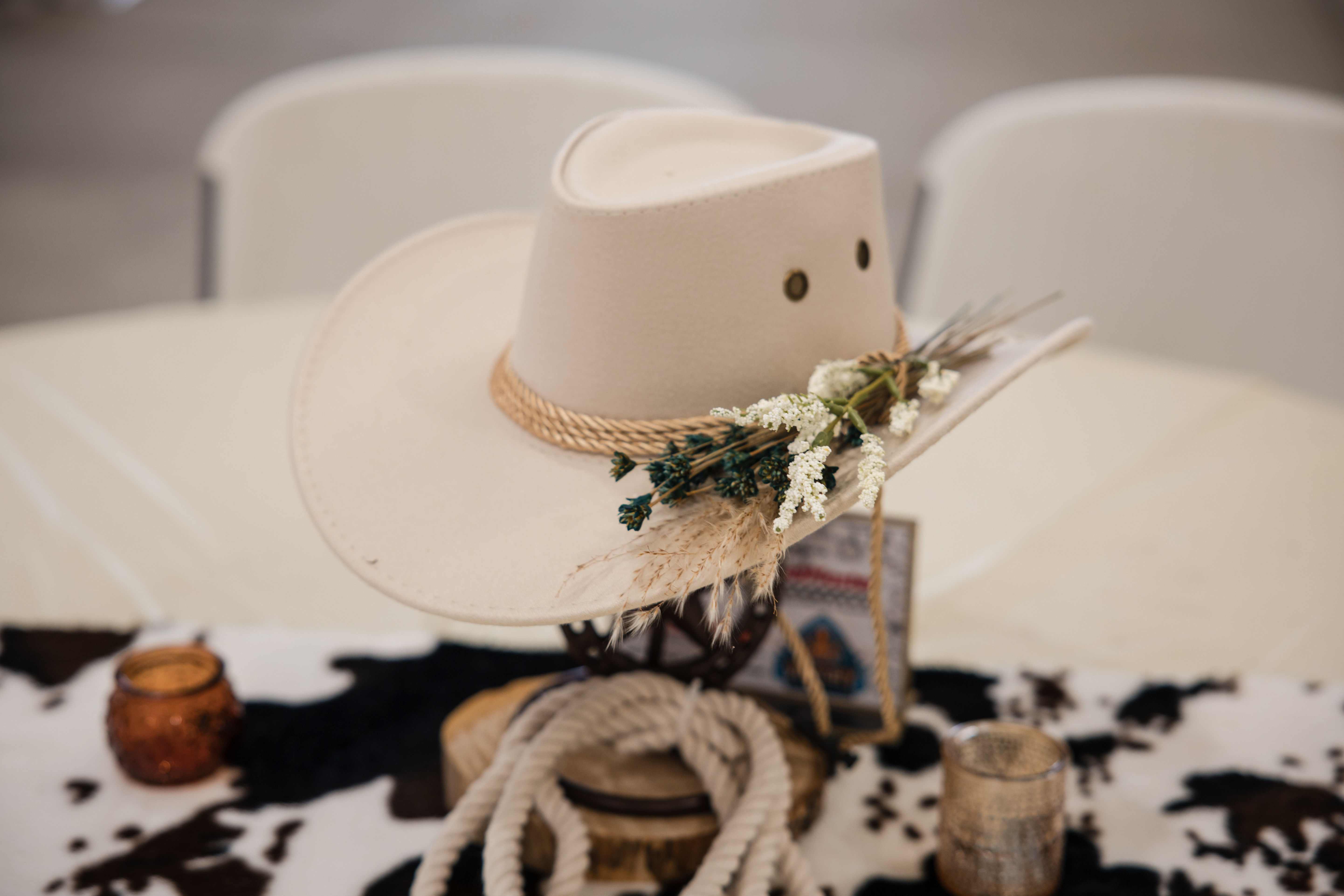 Western event decor cowboy hat centerpiece corporate gala