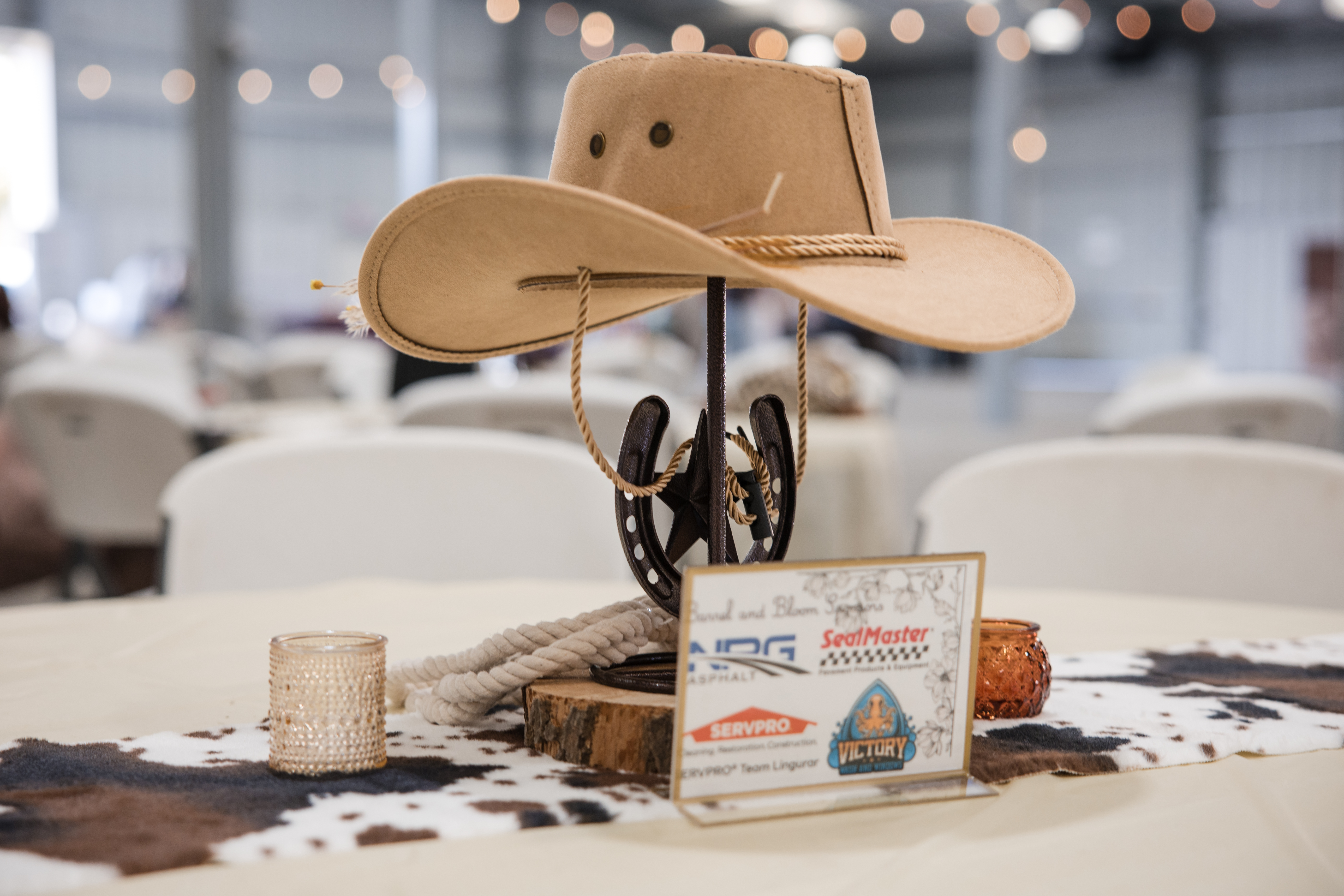 Event decor detail western themed corporate gala sponsor table
